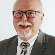 Headshot of Tony Burbach with a white background.